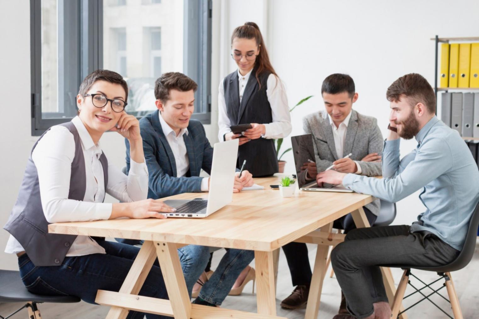 Financial planning consultation workspace with budgeting documents and forecasting tools